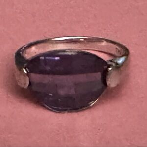 Thailand 925 sterling silver with oval purple
Rhinestone ring.